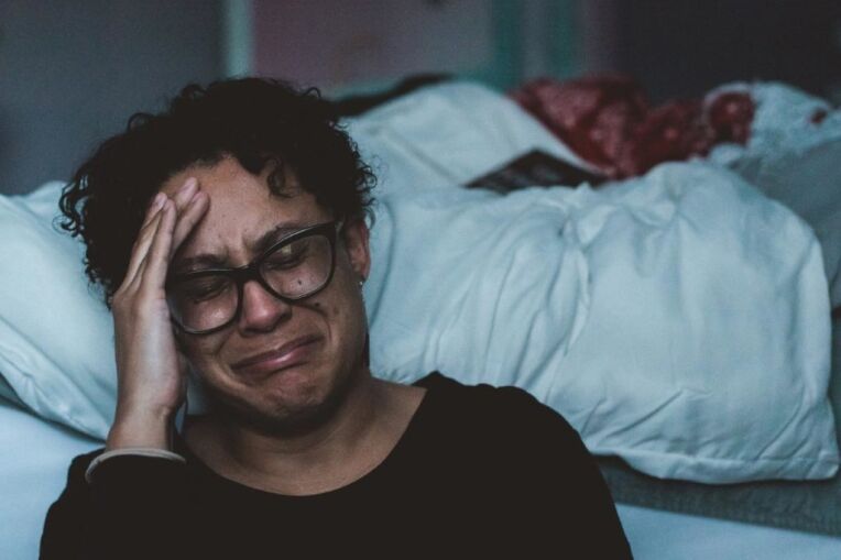 photo of a person crying and depressed because of racism