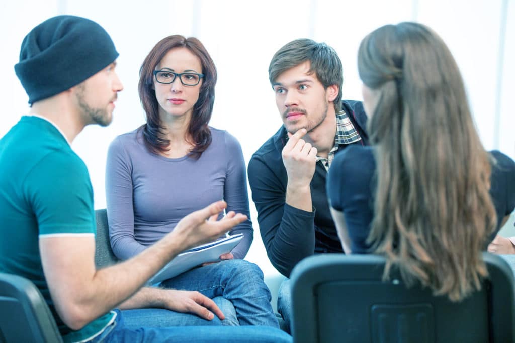 a man sharing his problems and experiences during a 12 step meeting