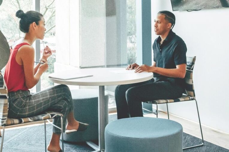 a male client with his therapist during an outpatient treatment program
