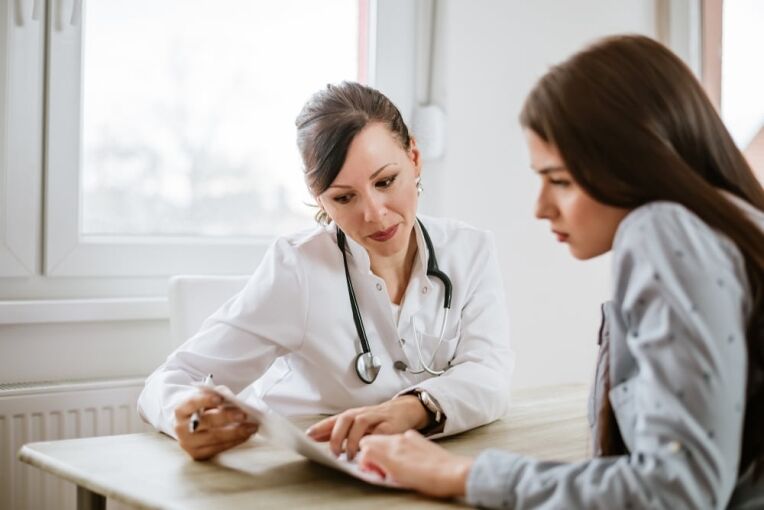 Charming,Female,Doctor,Giving,Advice,To,A,Female,Patient.